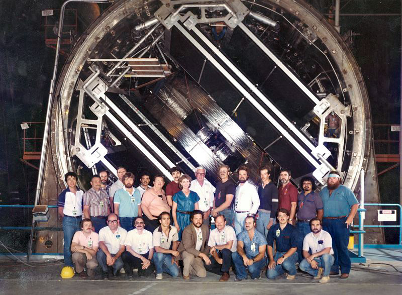 a group of people posed in front of the frame of the MFTF-B